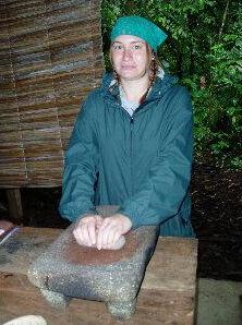 Becky Curland grinding cacao beans in Costa Rica, photo by Becky Curland